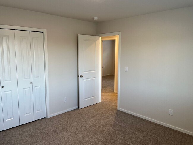 Building Photo - New Construction! Four Bedroom Home in Woo...