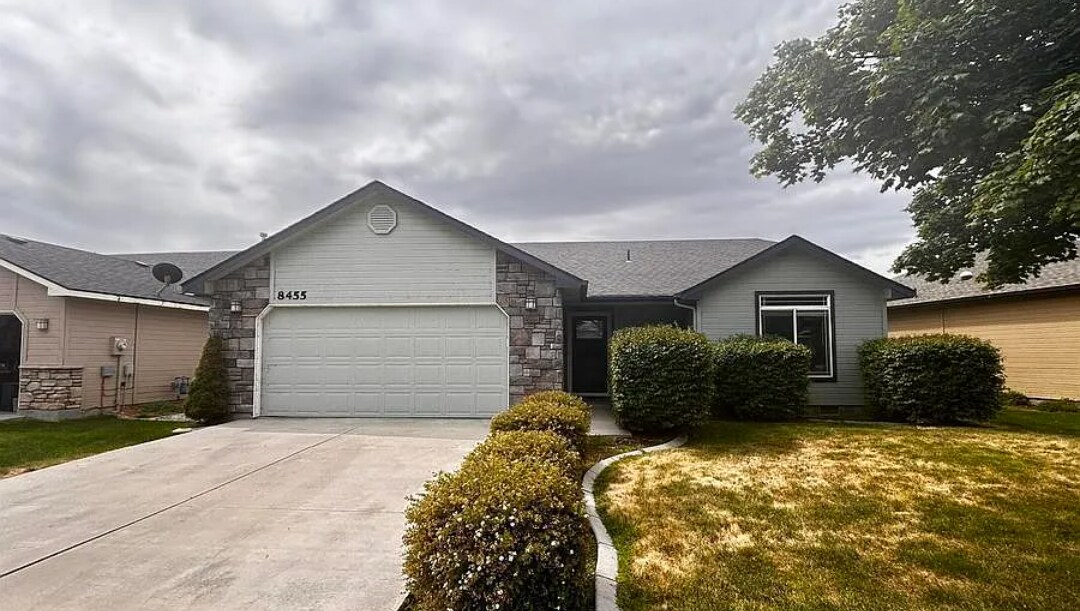 Front of house with a common area in the back - 8455 W Harmonica Way