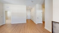 Located at 3801 Brody Dr in Greensboro, NC, this well-appointed 3-bedroom, 2-bathroom single-story home offers a thoughtfully designed layout with contemporary finishes throughout. The living room serves as a welcoming focal point, featuring elevated ceilings, a tile-surround fireplace, and multiple windows that fill the space with natural light. Light-toned hardwood-style flooring runs through the main living areas, complementing the home's clean, neutral palette.

The kitchen is equipped with gray shaker-style cabinetry, marble-look countertops, a subway tile backsplash, and a full suite of stainless steel appliances, including a refrigerator, range, microwave, and dishwasher. A window above the sink adds brightness to the workspace.

The three bedrooms are carpeted for comfort, each featuring ceiling fans, natural light from well-placed windows, and ample closet space. The primary bedroom offers a generous footprint with its own well-sized closet.

Both bathrooms are finished with gray shaker vanities, marble-look countertops, and matte black hardware. The primary bath includes a sleek walk-in glass-enclosed shower, while the secondary bath features a combined tub and shower. A hallway with built-in closets provides additional storage throughout the home.