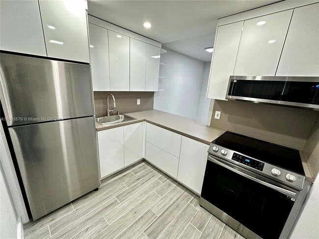 Building Photo - New World Condo Unit 212