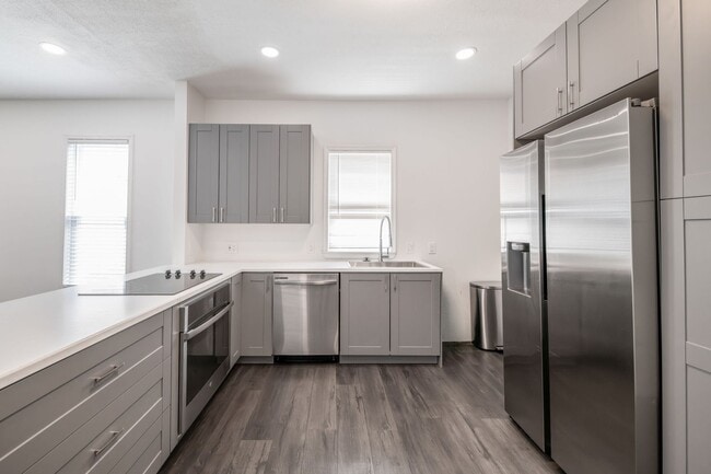 Building Photo - Stylish & Modern Living in the Heart of Tr...