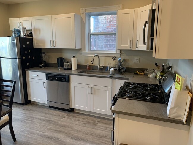 Photo - NO BROKER FEE | Renovated 4 Bed, 2 Bath with In-Unit Laundry | Mission Hill Townhome