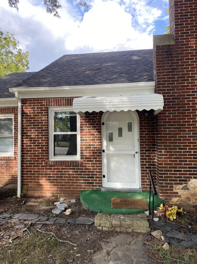 Quaint entrance with hearth and covered doorway. - 2028 Westover Dr