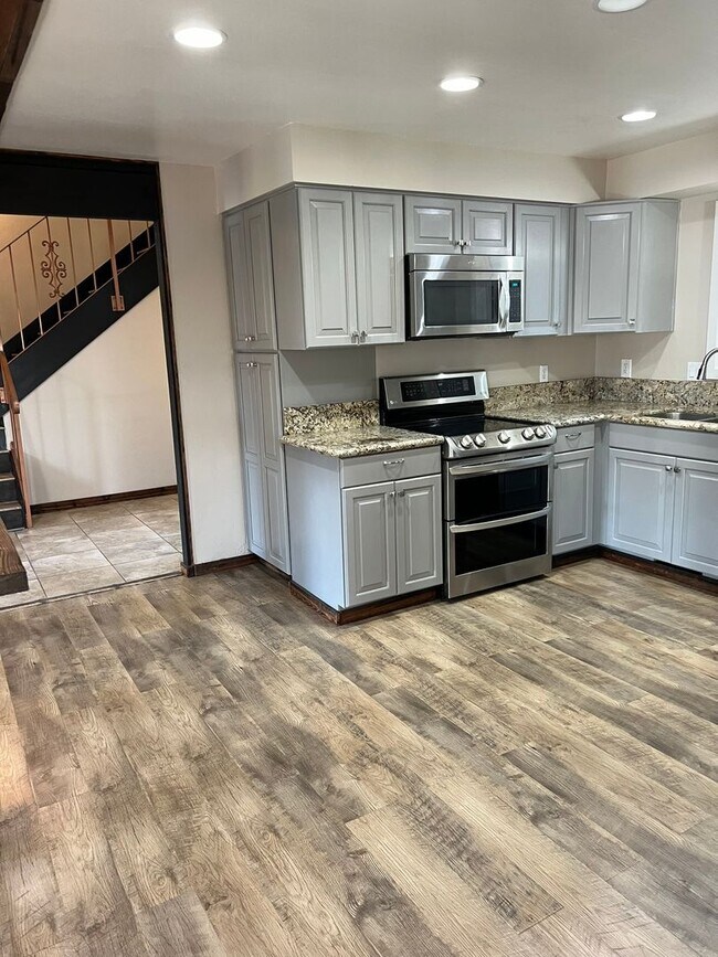 Building Photo - UPGRADED - REMODELED - CORNER LOT - ONE AC...