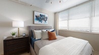 Located at 800 Chestnut St in Clearwater, Florida, this single-floor residence offers a thoughtfully designed layout that maximizes both function and style. The open-concept living and dining area serves as the heart of the unit, featuring light wood-tone flooring, crown molding, and a bold teal accent wall that adds a pop of color. Large windows with horizontal blinds allow generous natural light to fill the space, creating a bright and welcoming atmosphere throughout.

The kitchen is efficiently designed and equipped with stainless steel appliances, including a Whirlpool range with a smooth cooktop, an over-the-range microwave, and an in-unit washer. White shaker-style cabinetry pairs with granite countertops and a stainless steel sink to deliver a clean, contemporary aesthetic.

The bedroom is a comfortable retreat featuring wood-tone flooring, large windows for natural light, a textured ceiling, and ample wall space. The full bathroom continues the cohesive design with granite countertops, white cabinetry, a tub-shower combination, and wood-tone flooring. Overall, the unit presents a modern, cohesive style throughout its functional and well-lit spaces.