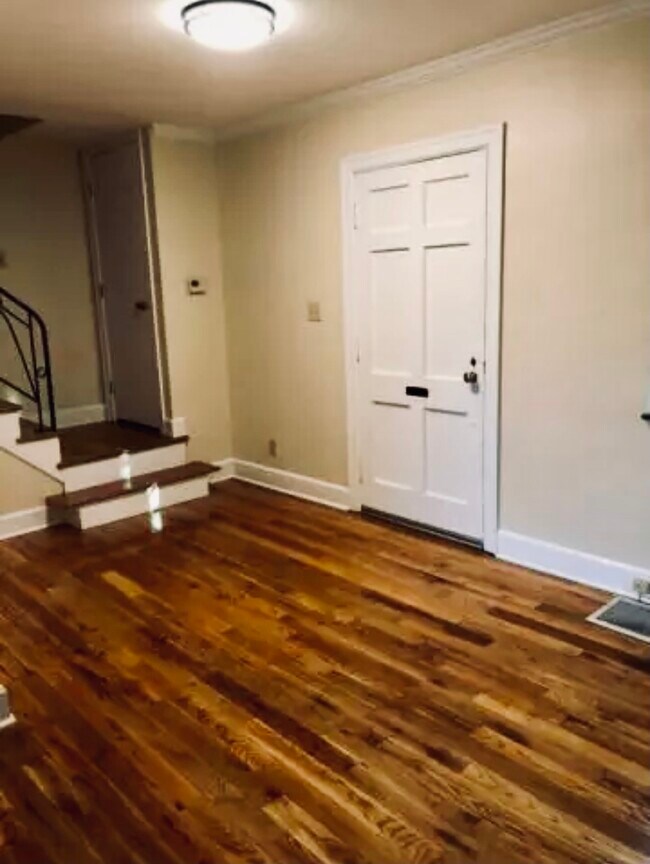 Foyer, stairwell to the second floor, and part of the living room - 1149 Cooper Dr