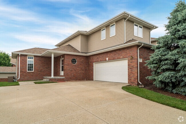 Each home includes a private two-car garage. - Cascade Pines Duplexes