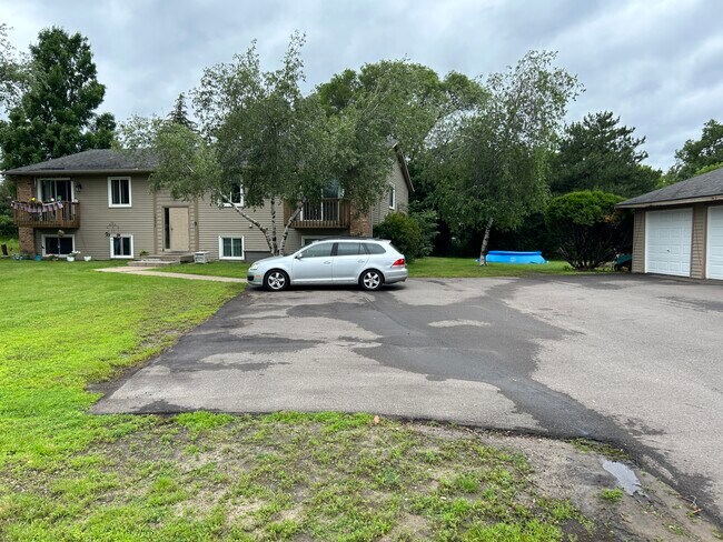 Parking Lot (shared) w/ garage stall (included in rent) - 16075 Joplin Ave