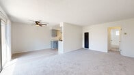 Located at 5189 Revere St in Chino, CA, this single-story 1-bedroom, 1-bathroom unit offers a thoughtfully laid-out floor plan across a single level. The bright and open living room features soft carpeting, a ceiling fan with light fixture, a textured ceiling, and a wall-mounted AC unit. Large sliding glass doors flood the space with natural light and provide direct access to a private enclosed patio — ideal for outdoor relaxation. The living area flows seamlessly into a dedicated dining space. The galley-style kitchen is efficiently designed with gray cabinetry on both sides, light stone countertops, a black matte sink with modern faucet, hardwood-style flooring, and a stainless steel gas range with overhead ventilation. A hallway connects the main living area to the private bedroom, which offers generous carpeted space, a window for natural light, and a reach-in closet with dual sliding doors and built-in shelving and hanging rods. The bathroom is clean and classic, featuring a full tub-shower combo with white tile surround, chrome fixtures, and a mirrored medicine cabinet. The unit presents a neutral, move-in-ready aesthetic throughout, combining functional design with everyday comfort.
