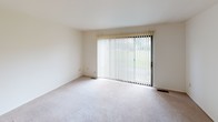 Located at 140 Princeton St S in Battle Creek, Michigan, this two-floor property offers a functional and straightforward layout across multiple well-defined spaces. The bedrooms are carpeted and equipped with ceiling fans, each featuring windows with vertical blinds that frame views of the surrounding greenery, allowing natural light to fill the rooms. The layout, visible in the dollhouse view, reveals a thoughtfully organized floor plan with generous room proportions and ample closet space throughout.

The living area is a standout space, highlighted by a full-width sliding glass door dressed with vertical blinds that open to an outdoor view, inviting in natural light and creating a seamless indoor-outdoor connection. The galley-style kitchen is efficiently designed with white cabinetry, dark countertops, a double stainless steel sink, a gas range, and a stainless steel refrigerator, all set atop durable tile flooring. A bathroom features tile flooring, a granite-topped vanity, and a tub-shower combination. Throughout the home, neutral tones and clean white walls provide a versatile backdrop, making each space adaptable for a variety of uses.