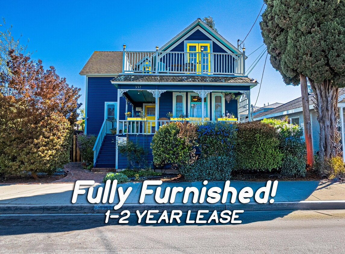 Charming blue exterior with cheerful yellow accents gives the home a warm, welcoming feel. - 337 W 16th St