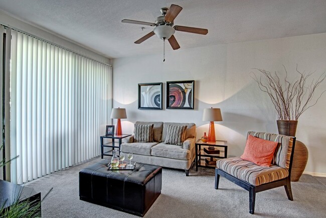 Acclaim Apartments- furnished living room with balcony - Acclaim