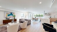 This elegant Beverly Hills property at 350 N Palm Dr offers a harmonious blend of luxury and functionality within its 1450 square feet. The single-story layout encompasses 2 bedrooms, including a spacious 240 sq ft primary suite, and an impressive 5 bathrooms, ensuring ample privacy and convenience.

The heart of the home is a stunning open-concept area combining the kitchen, dining, and living spaces. The gourmet kitchen features sleek wood cabinetry, high-end appliances, and a striking marble backsplash. Adjacent, the dining area boasts large windows that flood the space with natural light and offer verdant views.

The living room exudes sophistication with its neutral color palette, contemporary furnishings, and carefully curated artwork. Throughout the home, light wood flooring and recessed lighting create a bright, airy ambiance. The hallway showcases modern art pieces, adding personality to the transitional spaces.

Bathrooms are luxuriously appointed, with one featuring a spacious walk-in shower with glass enclosure and built-in seating. The master bedroom is a serene retreat, complete with large windows and minimalist decor.

This property seamlessly blends indoor and outdoor living, with sliding glass doors leading to exterior spaces. The attention to detail in design and finishes makes this Beverly Hills residence a true gem in a coveted location.