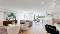 This elegant Beverly Hills property at 350 N Palm Dr offers a harmonious blend of luxury and functionality within its 1450 square feet. The single-story layout encompasses 2 bedrooms, including a spacious 240 sq ft primary suite, and an impressive 5 bathrooms, ensuring ample privacy and convenience.

The heart of the home is a stunning open-concept area combining the kitchen, dining, and living spaces. The gourmet kitchen features sleek wood cabinetry, high-end appliances, and a striking marble backsplash. Adjacent, the dining area boasts large windows that flood the space with natural light and offer verdant views.

The living room exudes sophistication with its neutral color palette, contemporary furnishings, and carefully curated artwork. Throughout the home, light wood flooring and recessed lighting create a bright, airy ambiance. The hallway showcases modern art pieces, adding personality to the transitional spaces.

Bathrooms are luxuriously appointed, with one featuring a spacious walk-in shower with glass enclosure and built-in seating. The master bedroom is a serene retreat, complete with large windows and minimalist decor.

This property seamlessly blends indoor and outdoor living, with sliding glass doors leading to exterior spaces. The attention to detail in design and finishes makes this Beverly Hills residence a true gem in a coveted location.