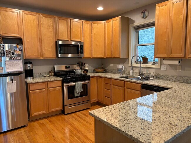 Kitchen with stainless steel appliances and granite counters - 1241 N Maplewood Ave