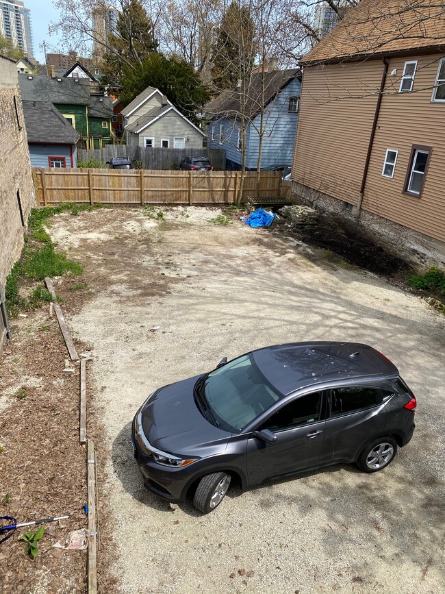 Rear fenced parking area - 1728 N Franklin Pl