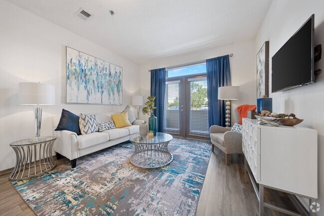 Charming Living Room with Hardwood-Style Flooring - Brunswick Point Apartments