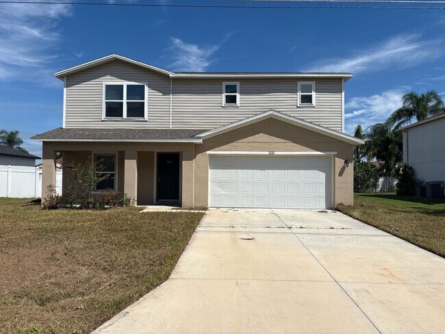 Foto del edificio - Spacious 4-Bedroom Home in Poinciana, FL –...