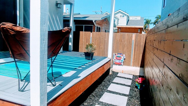 Deck now with steel rail and Curtind - 2871 Capps St