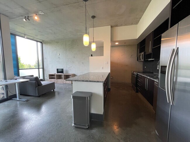 Foto del edificio - Awesome 1BR Loft Style Condo Overlooking M...