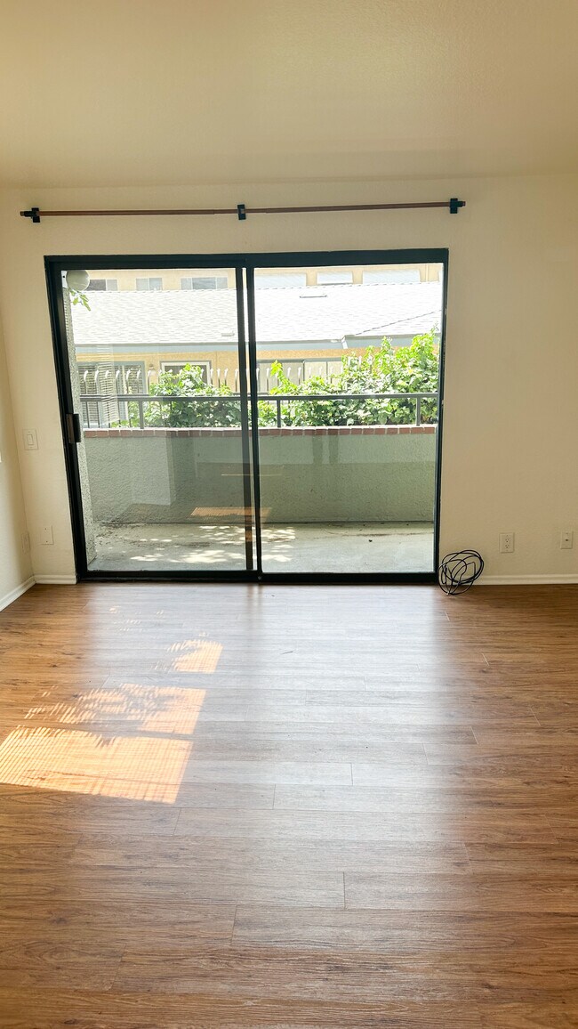 Living room access to private balcony - 1809 Peyton Ave