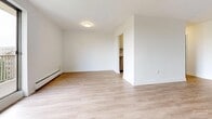 Located in Mornington, London, Ontario, this well-appointed one-bedroom, one-bathroom unit offers a thoughtfully designed single-floor layout. Light-toned hardwood flooring runs throughout, lending a clean and cohesive look to every room. The open living room is a standout feature, bathed in natural light thanks to a large sliding glass door that leads to a private balcony with views of surrounding greenery — an ideal spot for relaxing or enjoying fresh air. A baseboard heating system ensures year-round comfort. The kitchen is efficiently laid out with white cabinetry, dark countertops, a double stainless steel sink, and a classic subway tile backsplash, complemented by stainless steel appliances including a refrigerator and dishwasher. The bedroom offers a comfortable, well-sized retreat with a large sliding closet and a window overlooking the outdoors, providing both natural light and ventilation. The bathroom is finished in a crisp, modern style with white cabinetry, a stone-patterned countertop, an integrated sink, and tile flooring. The overall aesthetic is bright, clean, and contemporary, making this a practical and inviting space in a residential London neighbourhood.