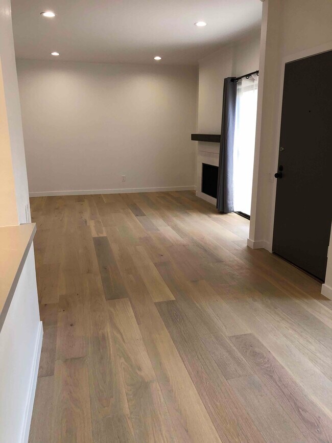 Open LR w new wood floors - 1655 Greenfield Ave