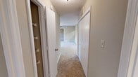 Located at 505 Fox Crossing Blvd in Knoxville, Tennessee, this single-floor, three-bedroom, two-bathroom home offers a practical and comfortable layout. The galley-style kitchen is well-equipped with light wood cabinetry, dark granite-style countertops, a double stainless steel sink, and black and stainless steel appliances including a range, microwave, dishwasher, and refrigerator, all set over easy-care hard surface flooring. The kitchen opens conveniently toward the living area, which features plush carpeting, a ceiling fan, and French doors that invite natural light and provide access to an outdoor patio. A carpeted hallway connects the three bedrooms, with the spacious primary bedroom offering room for generous furnishings and direct access to one of the two bathrooms, which features warm wood cabinetry, dark granite-style countertops, and a tub-shower combination with wood-look flooring. The additional bedrooms are well-sized with carpeted floors and windows providing natural light. Throughout the home, textured ceilings and neutral warm-toned walls create a cohesive and welcoming atmosphere. A dedicated closet adds practical storage to round out the functional floor plan.