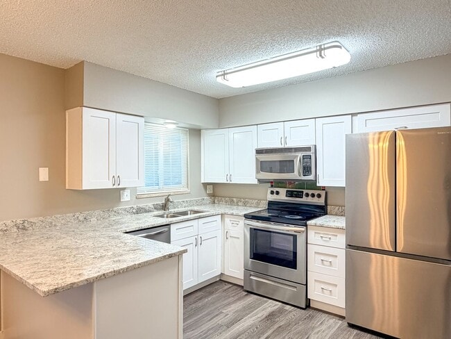 Updated Townhome with Covered Parking! - Updated Townhome with Covered Parking!