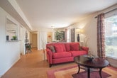 Located at 832 Blackfriars Dr in Virginia Beach, Virginia, this single-floor home offers a well-organized and cohesive layout with warm hardwood-style flooring connecting every room. The kitchen is a standout space, featuring crisp white shaker cabinetry, granite countertops, a classic subway tile backsplash, and a full suite of white appliances including a gas range, dishwasher, and refrigerator — combining a clean, modern aesthetic with practical functionality. The living room is a comfortable and inviting space, with a window that draws in natural light. Adjacent to it, a dedicated dining area provides an intimate setting for meals, complete with a closet and its own window. The primary bedroom is generously proportioned, featuring a large window, a walk-in closet, and convenient access to an in-unit washer. A second bedroom includes its own closet and benefits from natural light. The bathroom is well-appointed with granite countertops, a tiled tub-shower combination, and tile flooring. Throughout the home, neutral wall tones, consistent flooring, and ample closet storage contribute to a clean, functional, and move-in-ready living environment.