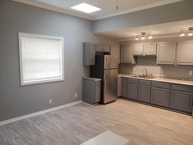 Kitchen w/ New SS Refrigerator - 324 E Railroad St