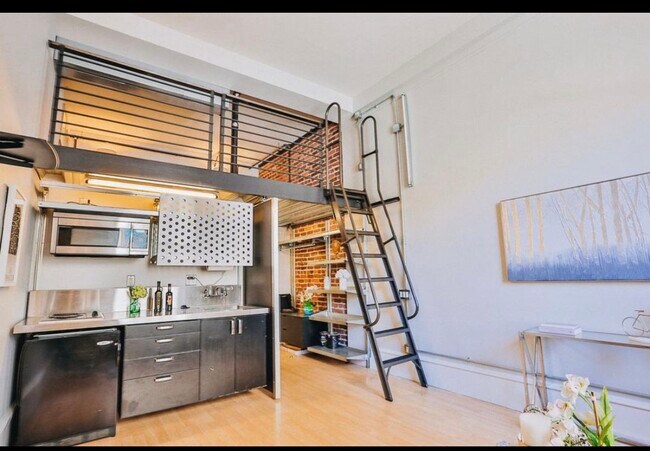 Kitchenette and stairs to loft - 83 McAllister St