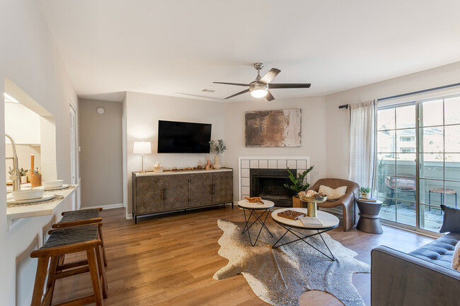 Newly Renovated Living Room with Hardwood-Style Flooring - The Landings of Brentwood Apartments