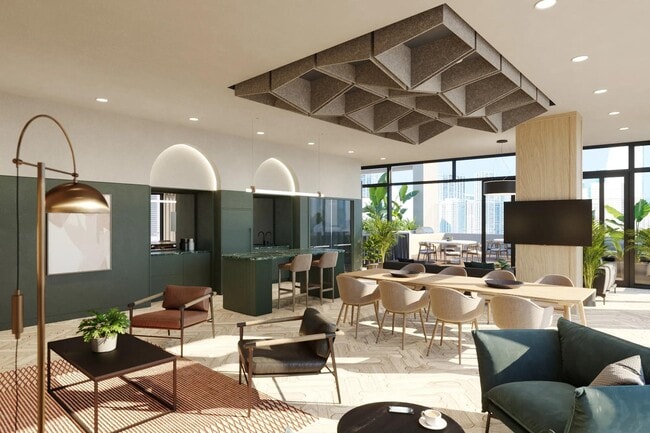 36th-floor social lounge with gathering space, demonstration kitchen, and outdoor terrace. - Modera Riverside