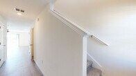 Located in Thonotosassa, FL, this two-story home offers three bedrooms and three bathrooms across two well-proportioned floors. The main level hosts an open-concept kitchen and living area with light wood-look flooring throughout. The kitchen is outfitted with white shaker cabinetry, granite countertops, a subway tile backsplash, stainless steel appliances including a French door refrigerator and electric range, and a central island with seating. A pantry adds convenient storage. The main level also includes an attached single-car garage with built-in electrical panel access. Upstairs, the three bedrooms are bright and airy, each featuring ceiling fans, light wood-look flooring, and generous closet space. The spacious primary bedroom benefits from a large closet and natural light. The three bathrooms are finished with granite-topped white vanities, wood-look flooring, and clean white subway tile walk-in showers. A dedicated laundry room adds everyday practicality. A standout feature is the upper-level access to a balcony with sliding glass doors that frame sweeping water views — a serene and scenic backdrop that elevates the overall living experience. Clean white walls and recessed lighting create a fresh, move-in-ready aesthetic throughout.
