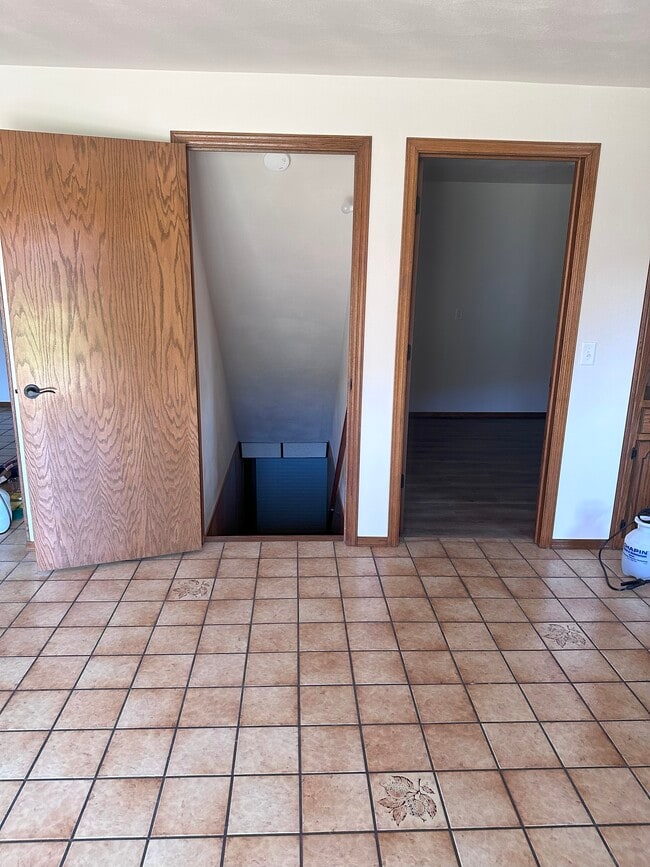 basement stairs and laundry door - 14 Duchess Ct