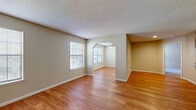 Located at 4470 S Lemay Ave in Fort Collins, CO, this 2-bedroom, 4-bathroom single-floor home offers a practical and comfortable layout designed for everyday living. The dual living areas are connected by a distinctive arched passageway and feature warm hardwood-style flooring throughout, with multiple windows that invite an abundance of natural light and a textured ceiling adding character to the space. The kitchen is equipped with rich dark wood cabinetry, granite-style countertops, and stainless steel appliances, including a full-size refrigerator and range. The primary bedroom is generously sized, complete with plush carpeting, a dedicated closet, and direct access to a private en-suite bathroom featuring dark wood vanity cabinetry and granite-style countertops. The second bedroom also offers carpeted flooring and a window for natural light. With four bathrooms throughout, the home provides ample convenience for residents and guests alike. A hallway with hardwood-style flooring leads to additional bathroom and closet access, maintaining a clean and organized flow. The neutral color palette throughout creates a calm, welcoming ambiance well-suited to Fort Collins living.