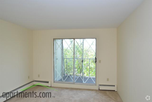 Bedroom With Balcony - Camelot Square Apartments