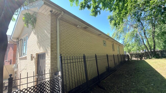 Side and rear of home. Private and gated. - 419 W Root St