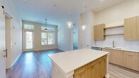 Located at 2828 Wicklow St in Savannah, GA, this well-appointed 2-bedroom, 2-bathroom residence offers a thoughtfully designed open-concept layout with contemporary finishes throughout. The combined kitchen and living area forms the heart of the home, featuring light wood-tone cabinetry, a white quartz island with pendant lighting, stainless steel appliances, a herringbone tile backsplash, and durable wood-look flooring. The living room benefits from large windows and a balcony door that invite abundant natural light and outdoor views, complemented by a ceiling fan overhead. The spacious primary bedroom includes a ceiling fan, generous natural light, and access to a dedicated ensuite bathroom featuring a dual-sink vanity with warm wood cabinetry, quartz countertops, a glass-enclosed walk-in shower with marble-style tile surround, and matching wood-look flooring. The second bedroom is equally well-lit with wide windows and a ceiling fan. The second bathroom offers a full tub-shower combo with an elegant marble-style surround. Both bedrooms are served by dedicated closets with built-in wire shelving systems. A sliding barn door accent adds a modern touch to the interior hallways, rounding out this clean, contemporary residence.