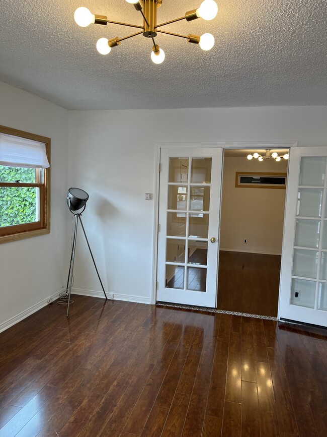 Living room with French doors to bedroom - 2228 1/2 S Ridgeley Dr