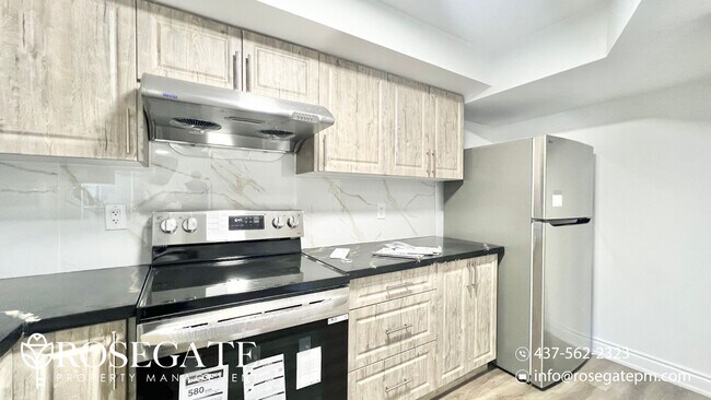 Photo du bâtiment - Newly Renovated 2-Bedroom Basement Unit in...