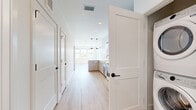 Located at 2735 Mountain Brook Dr in Longmont, Colorado, this well-appointed one-bedroom, one-bathroom unit offers a thoughtfully designed single-floor layout with modern finishes throughout. Light hardwood flooring flows through the main living areas, creating a bright and cohesive aesthetic.

The kitchen is a standout feature, showcasing warm-toned cabinetry, a subway tile backsplash, stainless steel appliances, and a white quartz peninsula with pendant lighting overhead. A window above the sink invites natural light, making the space feel open and functional.

The living room benefits from multiple windows and a door that appears to lead to an outdoor balcony, filling the space with abundant sunlight and exterior views of the surrounding Longmont neighborhood.

The bedroom is generously sized, finished with plush neutral carpet and windows that provide natural light and outdoor views. A dedicated closet adds practical storage. The bathroom is elegantly appointed with large-format marble-style tile in the tub/shower surround, a white quartz vanity, hardwood-style flooring, and sleek matte black fixtures that lend a contemporary touch.

Clean white walls, recessed lighting, and a consistent modern design language unify this well-proportioned unit, making it an attractive and functional living space.