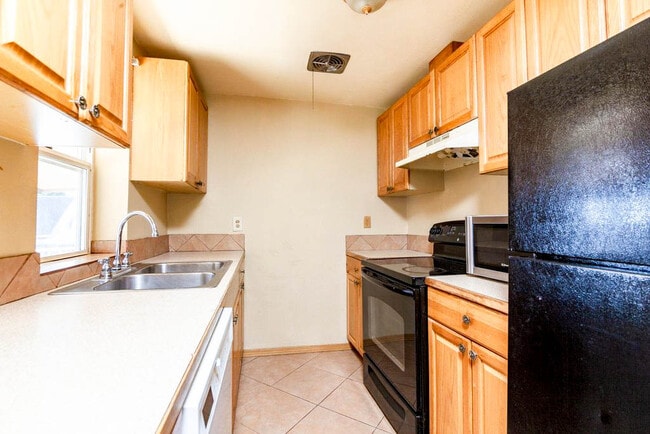 Kitchen features tons of cabinet & storage space! - 10432 Occidental Ave S