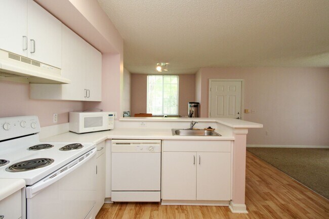 Building Photo - *GATED Community - Charming 1-Bedroom Cond...