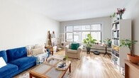 Located on University Avenue SE in Minneapolis, this one-bedroom, one-bathroom unit offers a well-organized and efficient single-floor layout. Warm hardwood flooring runs throughout the space, creating a cohesive and inviting atmosphere from entry to bedroom.

A welcoming hallway with a sliding wood door leads into the main living area, which seamlessly integrates the living room and kitchen. The living room is bright and airy, anchored by a large window that allows generous natural light to fill the space. The kitchen features light natural-wood cabinetry, a gray countertop, a full-size refrigerator, and a sink with practical storage. An adjacent pantry adds valuable storage capacity.

The bedroom is spacious and well-lit, benefiting from a large window with a built-in sill. Hardwood floors continue here, and the room comfortably accommodates a full bed, workspace, and additional storage. The bathroom includes a full tub-shower combination with classic white tile flooring featuring a subtle mosaic border, a toilet, and vanity with additional shelving.

Throughout, the unit maintains a clean, neutral palette with white walls and light trim, offering a calm and functional living environment well-suited for those seeking proximity to the University of Minnesota campus.