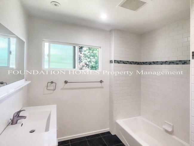 Building Photo - Enjoy sweeping views from top level duplex...