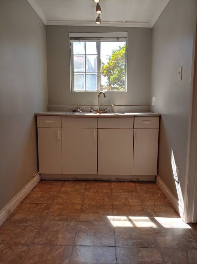 Small kitchenette/lounge area. - 7781 Bently Ave