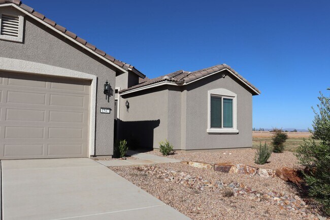 Building Photo - Beautiful four bedroom home with three car...