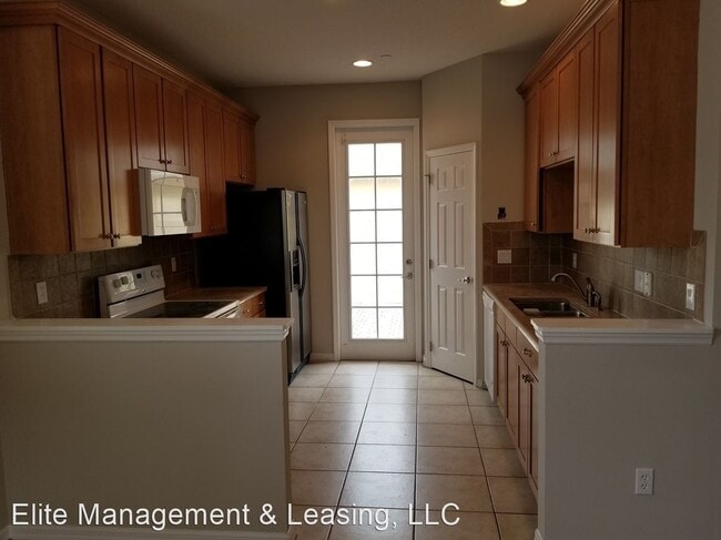 Building Photo - 4 br, 3 bath House - 9101 Camden Gardens St.